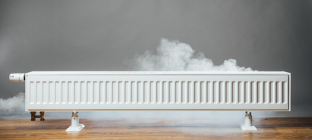 heating radiator at home with warm steamの写真素材