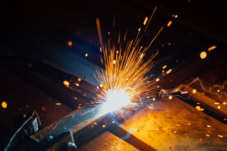 artistic welding sparks light, industrial background