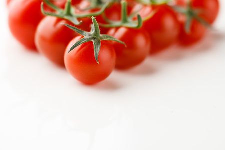 cherry tomatoes on white backgroundの写真素材