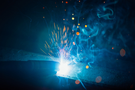 artistic welding sparks light, industrial background