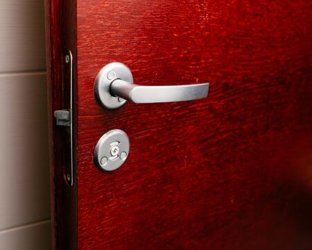 red wood mahogany door with handle