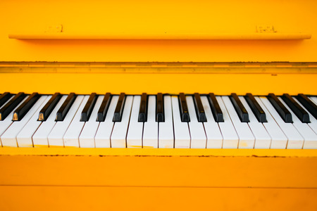 yellow vintage piano, closeup viewの写真素材