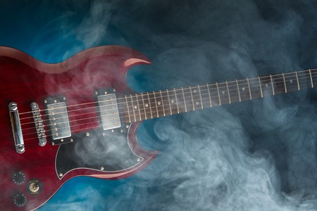 electric guitar in smoke, closeup view