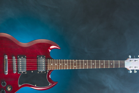 electric guitar in smoke, blue backgroundの写真素材