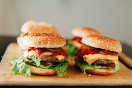 fresh homemade burgers on wooden trayの写真素材