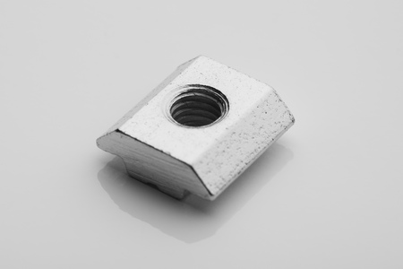 slide screw nut on white background, closeup view