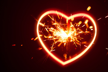 heart light with sparks backgroundの写真素材