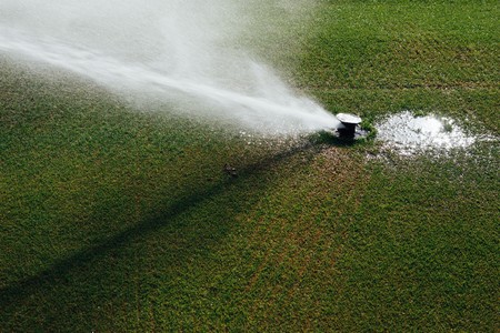 golf course automatic lawn sprinklerの写真素材