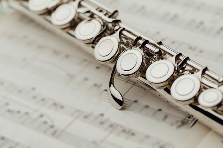 transverse flute on music sheetの写真素材