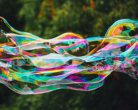 soap bubbles abstract shape, green background