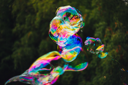 soap bubbles abstract shape, green background