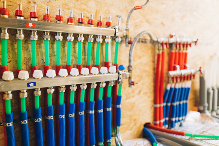 underfloor heating manifold collector with pipesの写真素材