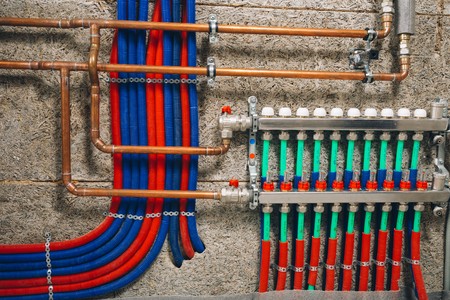 manifold collector with pipes of underfloor heating system