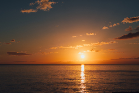 sunrise at ocean seascape with reflectionの写真素材