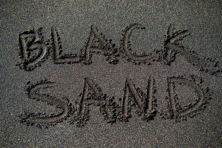 volcanic beach black sand text titleの写真素材