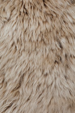 brown sheepskin fur texture backgroundの写真素材
