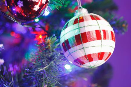 Christmas tree red and white striped ball decoration, close-up viewの写真素材