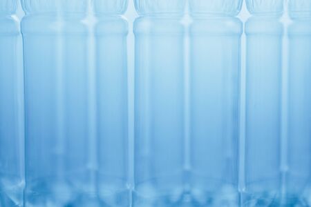 empty plastic bottles blue abstract background, close-up viewの写真素材