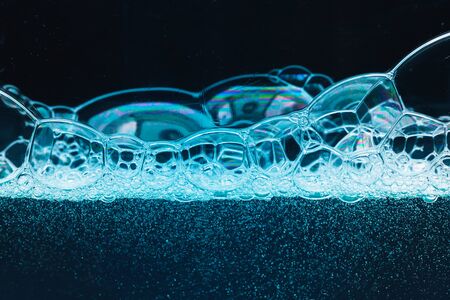 abstract liquid soap bubbles blue backgroundの写真素材