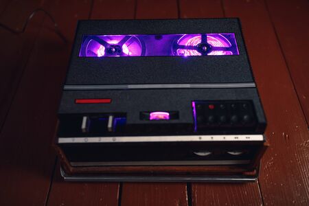 reel to reel audio tape recorder with purple led light strip