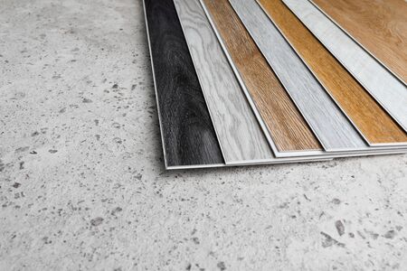 laminate flooring planks variations on concrete floorの写真素材