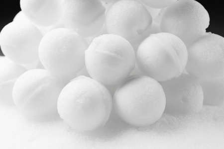 many snowballs on white snow backgroundの写真素材