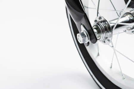 part of kids bicycle wheel with spokes, white background