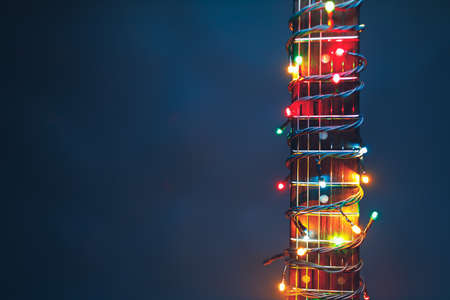guitar finger-board with multicolor lights, festive backgroundの写真素材