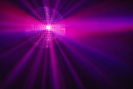 disco ball background with purple shiny rays in fog