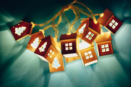 bundle of house shape Christmas garlands, blue background