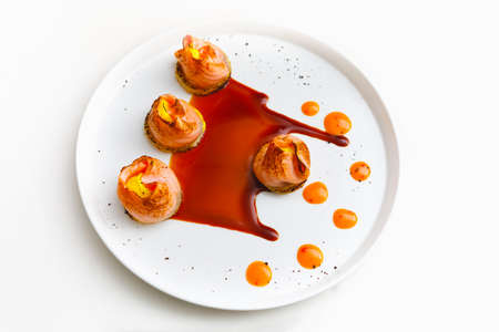 salmon tataki with sauce on white plateの写真素材