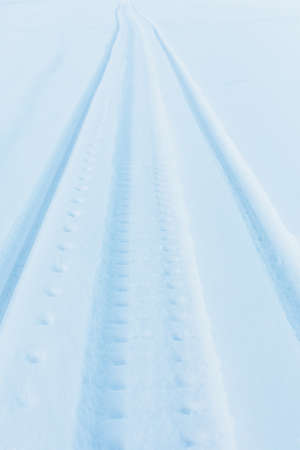 snow track imprint of snowmobile, close-up view