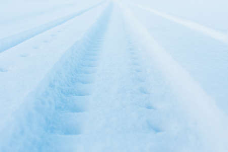 snow track imprint of snowmobile, close-up viewの写真素材