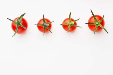 cherry tomatoes on white background with copy-spaceの写真素材