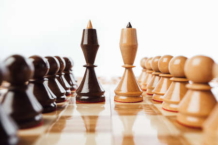 wooden chess pieces queens on the chessboard, close-up viewの写真素材