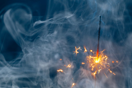 abstract Christmas sparkler firework copy-space background with smokeの写真素材