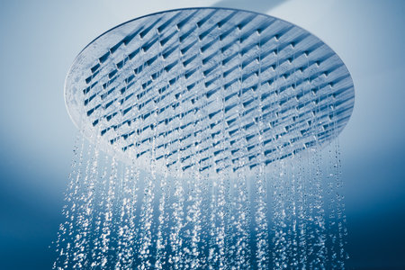 water drops falling from large rain shower headの写真素材