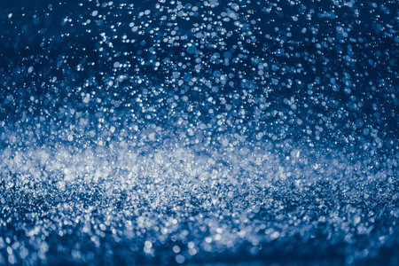 rain water drops on the ground, blue bokeh background, close-up viewの写真素材