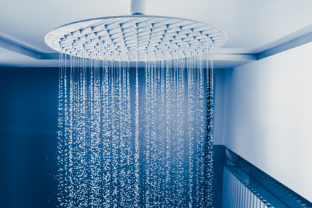 water drops falling from large rain shower headの写真素材
