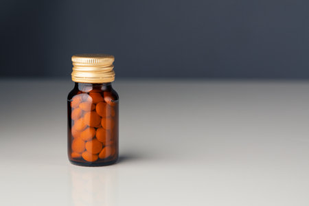 bottle with vitamin pills, copy-space backgroundの写真素材