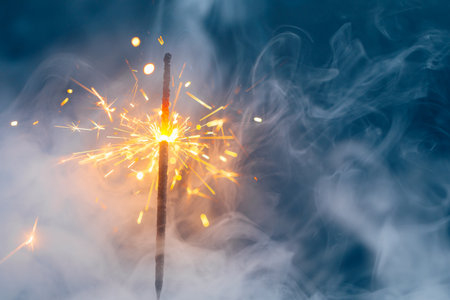 abstract Christmas sparkler firework background with smokeの写真素材
