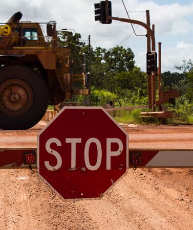 Big Stop sign at barrier crossing. Outback, Weipa, Queensland, Australiaの写真素材