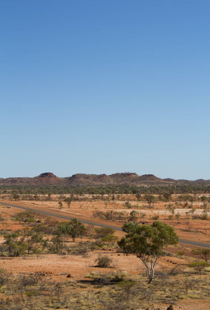 Long straight highway trough the Australian OutbackMT ISA, Queensland, Australia.の写真素材