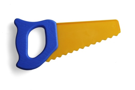 saw, a plastic toy on a white backgroundの写真素材