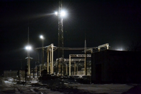 Dark winter night fell by power substation