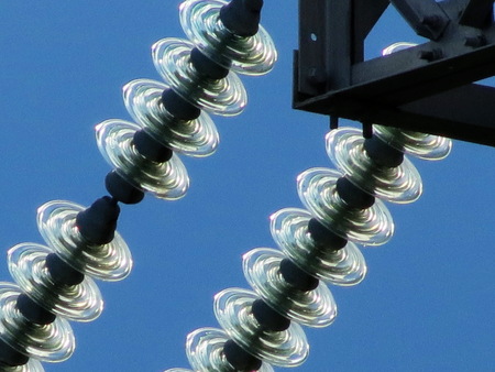 Electric high-tension full tilts is pulled through steppe Altaya