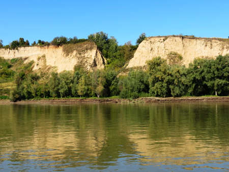 Flows big river amongst steep high coastの写真素材