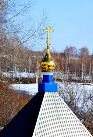 Rustic church in winter and summer decorates rural landscapeの写真素材