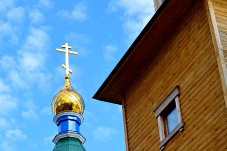 Rustic church in winter and summer decorates rural landscapeの写真素材