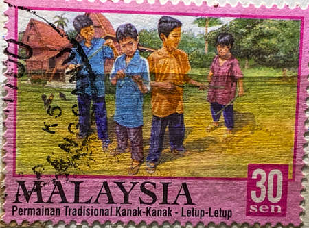 MYGIG123RF - Traditional Malaysian children games. Malaysia stamp.の写真素材